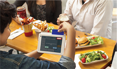 Customer Paying at Restaurant using Tablet POS System